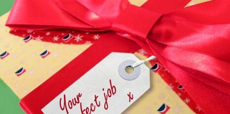 Graphic of a present with a big red bow and a tag reading Your Perfect job
